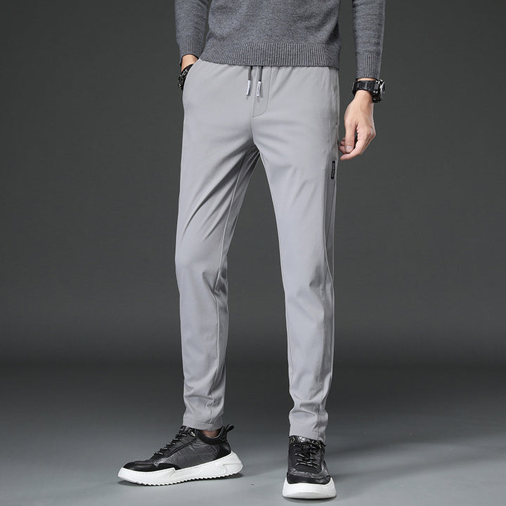 Herren schmal geschnittene Sporthose mit elastischem Bund und praktischen Reißverschlusstaschen Aliams